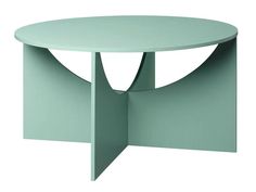 a round table with an unusual design on the top and bottom, in light green