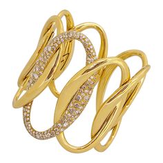 Made exclusively for Cellini NYC by g. Verdi of Italy, this 18 karat yellow gold and diamond cuff bracelet is a real showstopper. Interlocking links in a hi-polished yellow gold finish with the center link set entirely with rose cut and brilliant cut round diamonds. The combination of the two different cuts of diamonds along with the 2.5" length of the cuff create this very special piece. The interior width of the cuff is 2.25", designed with an inner tension to open and then sit very comfortabl Fine Jewelry Gold Cuff Bracelet With Brilliant Cut, Gold Pave Setting Cuff Bracelet For Formal Occasions, Formal Gold Cuff Bracelet With Pave Setting, Hand Set Diamond Cuff Bracelet In Yellow Gold, Diamond Yellow Gold Cuff Bracelet Fine Jewelry, Yellow Gold Cuff Bracelet With Brilliant Cut, Yellow Gold Brilliant Cut Cuff Bracelet, Cuts Of Diamonds, Diamond Cuff Bracelet