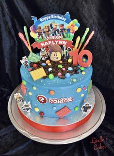 a birthday cake decorated with characters and decorations