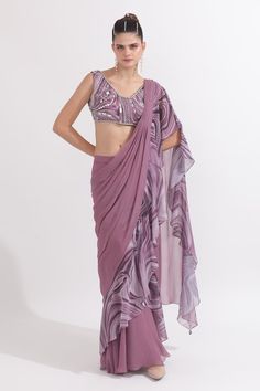 Dusky lilac georgette pre-draped saree with marble printed ruffled detailing. Comes with a padded blouse with pearls and sequins hand embroidery. - Aza Fashions Fitted Ruffled Saree, Chiffon Saree With Ruffles In Traditional Drape, Summer Georgette Saree With Ruffles, Ruffled Chiffon Saree In Traditional Drape, Silk Saree With Ruffles, Fitted Chiffon Saree With Ruffles, Elegant Draped Blouse Piece With Ruffles, Festive Pre-draped Sleeveless Saree With Ruffles, Summer Fitted Saree With Ruffles