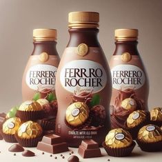 three bottles of ferro rocher next to some chocolates