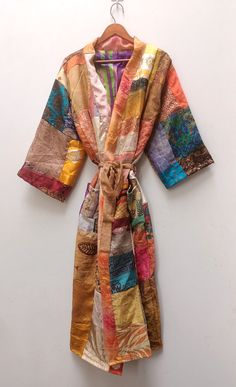 Silk Patchwork Kimono, Bridesmaid Robe, Dressing Gown, Long Wear, Boho Kimono, Bridal Robe, Casual Wear, Home Dress, Beach Wear,Unique Gift This gown is luxury Indian Silk, a beautiful soft, elegant and sensual fabric, which drapes beautifully over the body. These robes are the perfect present for a loved one or for yourself. The fabric is so luxurious and beautiful. Great to wear around the house or to dress up with jewellery or with some jeans & a t-shirt to go out. NOTE : This is vintage patchwork item. It is one of kind. Photo shown in the listing are to shown just an example. Similar will be come according to the color variation. Measurements or Sizes: Length- 48 Inches ( Approx. ) Bust Around- 48 inches ( Approx. ) Sleeve-17 inches ( Approx. ) Size: Free Size Kimono FREE SHIPPING WOR Bridesmaid Bathrobe, Bohemian Robes, Silk Bathrobe, Flowy Gown, Luxury Lounge, Patchwork Kimono, Kind Photo, Bridal Kimono, Silk Dressing Gown