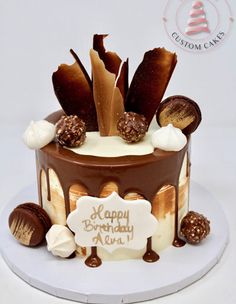 a birthday cake decorated with chocolate and marshmallows