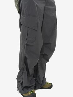 Editor's notesRipstop String Cargo Pants by NON FLOOR features strings placed on both sides of the side line  and the silhouette and shirring detail of the pants are determined by the degree of tightening the strings. This pants can be styled with a silhouette ranging from wide to flared  allowing for versatile styling options. The interior is treated with mesh  preventing it from sticking to the skin even when worn as nylon pants in sweaty conditions.- Cargo pocket on both sides of the side lin Border Security Force, Nylon Pants, Fashion Inspiration Design, Cargo Pocket, Active Wear Pants, Winter Casual, Cargo Pants, Dark Gray, Elastic Waist