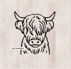 a drawing of a cow's head on a wooden background with the words by juliat