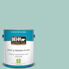 a can of behr premium plus paint and primer in one on a blue background