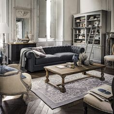 a living room filled with furniture and decor