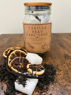 a jar filled with vanilla and orange slices