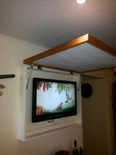 a flat screen tv mounted to the side of a wall