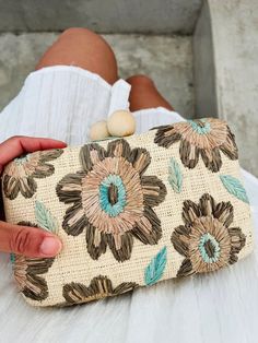 Whether planning for drinks at dusk or dancing until sunrise, this hand embroidered clutch will turn heads. Straw is meticulously woven and hand-embroidered. Features wooden ball clasps. Fully lined with an optional chain shoulder strap. Measures 7.75” W x 4.75” H x 2.25” D. Chic Embroidered Summer Clutch, Summer Embroidered Pouch Clutch, Embroidered Clutch For Evening In Summer, Traditional Embroidered Summer Clutch, Elegant Embroidered Clutch For Summer, Bohemian Embroidered Clutch Evening Bag, Bohemian Summer Evening Clutch, Embroidered Straw Hat, Envelope Clutch Bag