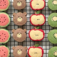 there are many cupcakes made to look like bears and apples