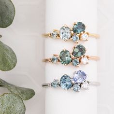 Introducing our new and larger Sapphire Cluster Stardust Ring collection, where elegance meets versatility. Each ring boasts a stunning array of four different sapphires and one natural diamond, carefully selected to create a harmonious blend of colors and brilliance. Designed with a low profile setting, these rings offer a distinct advantage by sitting close to the finger, ensuring comfort and practicality for everyday wear.  * One of a kind ring (choose between 5 different rings) * In stock re 5 Stone Cluster Ring, Luxury Multi-stone Sapphire Birthstone Ring, Luxury Sapphire Cluster Ring Fine Jewelry, Non Wedding Diamond Rings, Luxury Multi-stone Sapphire Promise Ring, Cluster Stone Ring, Modern Cluster Ring, Asymmetrical Cluster Ring, Gemstone Cluster Earrings