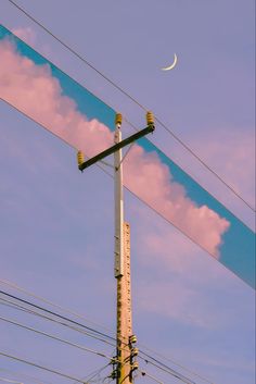 the moon is visible above power lines and telephone poles with wires in the foreground