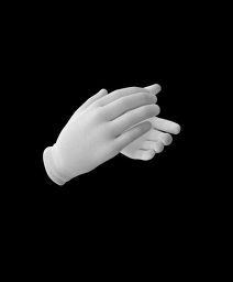 two hands reaching out towards each other in black and white, against a dark background