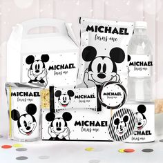 the mickey mouse lunch box is shown with its contents in front of polka dot dots