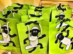 green bags with black and white sheep on them