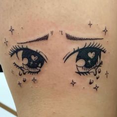 an eye tattoo on the side of a woman's right leg with stars and hearts