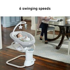 a baby in a swing with the text 6 swinging speeds on it's side