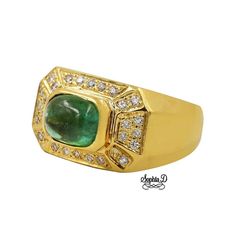 a gold ring with a green stone surrounded by diamonds