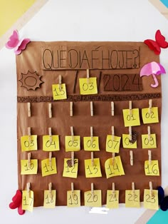 a bulletin board that has been decorated with sticky notes and magnets on clothes pins