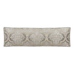 a rectangular pillow with an intricate design on the front and back, along with a silver border