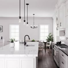 a large kitchen with white cabinets and marble counter tops