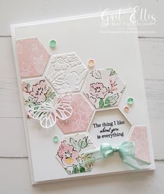 a close up of a greeting card with flowers and butterflies on the front, in white background