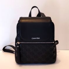 High Quality Vegan Leather Black And Silver Puffy With Logo It Has Triple Compartment Function Lots Of Storage Space Backpack Calvin Klein Bags Backpacks, Space Backpack, Calvin Klein Bags, Calvin Klein Bag, Flap Backpack, Black And Silver, Black Backpack, Womens Calvin Klein, Logo Branding