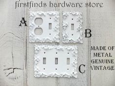 two white switchplates are shown with the words, firsthand hardware store and made of metal genuine vintage