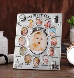 a baby's first year photo frame on a table