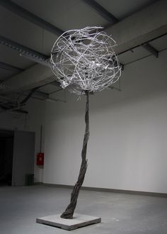 a sculpture is shown in an empty room