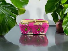 Feel special with this beautiful, embroidered clutch. Attractive & affordable fashion accessory designed using rich fabric and intricate work. Perfect for gifting on occasions like baby shower, housewarming, wedding, sangeet, return gift, griha pravesh pooja, Diwali, Holi, Ganpati, Dussehra, Durga pooja, Laxmi Pooja, Eid, Ramadan, Gudi Padwa, Onam, Pongal, Ugadi, Navratri etc. The Pichwai designs are one of the most ancient forms of paintings with origin from Rajasthan. This design usually depic Traditional Festive Rectangular Clutch, Traditional Rectangular Festive Clutch, Pink Rectangular Potli Bag With Zari Work, Rectangular Pink Potli Bag With Zari Work, Dori Work Potli Clutch Bag As Gift, Dori Work Clutch Potli Bag As Gift, Clutch Potli Bag With Dori Work For Gift, Rectangular Multicolor Clutch For Celebrations, Multicolor Rectangular Clutch For Celebration