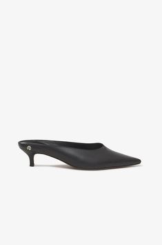 ANINE BING Rooney Mules - Black Black Slip-on Mules, Luxury Chic Slip-ons With Round Toe, Luxury Round Toe Mules For Evening, Luxury Chic Slip-on Mules, Luxury Modern Slingback Mules, Luxury Open Toe Mules For Night Out, Luxury Sleek Open Toe Mules, Luxury Fitted Mules With Single Toe Strap, Luxury Sleek Mules With Round Toe