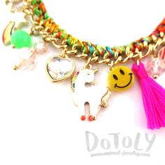 This bracelet is so happy and colorful! It's made with a bunch of different enamel charms in the shape of hearts, rainbows, unicorns and more with braided rope on the chain for added color!For more unique and affordable bracelets please visit our store! Store FAQ | Returns & Exchanges | Facebook Size: Adjustable, 25.5 cm the longestMaterial: Beads, Gold Plated Charms, String Smiley Faces, Gold Charm Bracelet, Braided Rope, Unicorn Rainbow, Enamel Charms, Animal Jewelry, So Happy, Smiley, Beautiful Jewelry