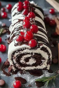 a roll with chocolate and cherries on it