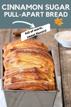 a loaf of cinnamon sugar pull apart bread in a pan on a wooden table with text overlay