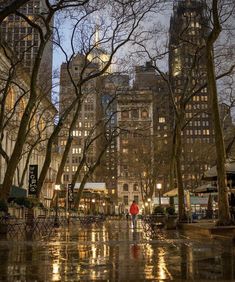 a person walking down a street in the rain