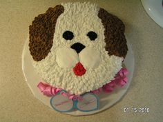 a cake that looks like a dog with glasses on it's face and nose