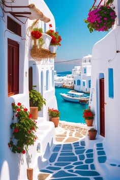 an alley way with flowers and potted plants on the side, leading to boats in the water