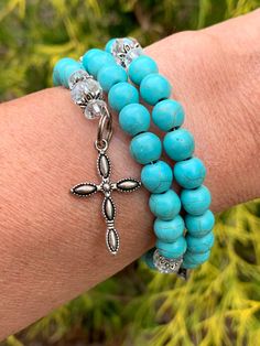 This is a beautiful hand crafted 5 decade rosary wrap bracelet made out of 8 mm glass beads and stainless steel memory wire.  This bracelet is a replica of a full rosary and has a silver plated cross and praying hands at each end.  It is a beautiful accessory to wear when you are ready to use it.  Since it fits snuggly on your wrist, it will leave your hands free as you are getting ready.  Place it on your wrist and you will never forget it at home.  I hope you love this. It comes in a silver ga Wrist Bracelet Tattoo, Bracelet Tattoo, Decade Rosary, Tattoo Bracelet, Catholic Jewelry, Praying Hands, Wire Wrapped Bracelet, Wrap Bracelets, Jewelry Wire