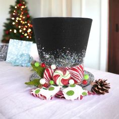 a top hat decorated with candy canes and christmas decorations