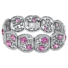 Extraordinary one of a kind platinum diamond bracelet, set with 15 ultra fine round Pink Sapphires, weighing a total of 19.54 carats, and round brilliant diamonds weighing a total of 10.99 carats. Total length: 7 inches. Total width: 1.75 inches. Returns are accepted and paid by us within 7 days of delivery. Sapphire is the birthstone for September, and it is also the celebrated 5th Anniversary gemstone. . Please FOLLOW the TAMIR and the MERKABA storefronts to be the first to view the latest of Egyptian Bracelet, Pink Sapphire Jewelry, Pink Sapphire Earrings, Platinum Bracelet, Retro Bracelet, Bracelet Tennis, Art Deco Bracelet, Modern Bracelets, Emerald Bracelet