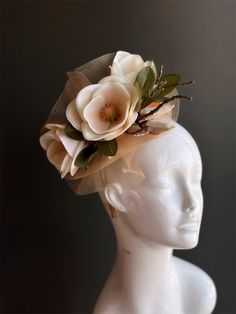 elegant magnolia flower fascinator headpiece, perfect for tea parties, derby events, and other special occasions! Thank you for supporting small businesses and we hope our products bring you and your loved ones Joy & Happiness! S H I P P I N G  -   Last minute masquerade mask shopping? 24 hr processing available. Pick appropriate shipping method and leave us checkout note! 1-2 day guaranteed delivery services also offered, add items to cart and click on shipping tab for rates.  Pls leave a check out note with your need date & contact number (especially for expedited and custom orders) Msg for delivery time frames (Include your state/country). S I Z E Adult size. Detailed dimensions are available upon request. C O N T A C T Text: 1-516-654-4643 Email: Lanai.ink6 [!at] gmail.com Web: www.hig Flower-shaped Fascinator With Handmade Flowers For Garden Party, Spring Party Flower-shaped Fascinator, Elegant Face Mask, Flower-shaped Fascinator For Kentucky Derby, Summer Formal Flower-shaped Fascinator, Luxury Flower-shaped Women's Fascinator, Metal Mask, Headpiece Accessories, Children's Mask