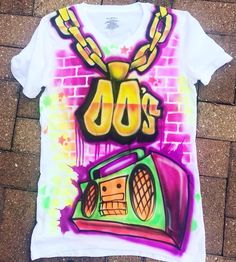 a t - shirt with the word 100's on it and a boombox