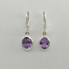 This is a  beautiful pair of purple Amethyst Earrings in 925 Sterling Silver. They are made out of Sterling Silver with no nickel so there should be no allergic reaction and nothing will turn green. The silver is not only silver plated or steel but solid 925 Sterling Silver. We usually ship the same day in a nice gift box. Classic Teardrop Purple Earrings, Classic Sterling Silver Purple Earrings, Classic Purple Sterling Silver Earrings, Purple Amethyst Earrings, Earring Ideas, Allergic Reaction, Amethyst Earrings, Purple Amethyst, Sterling Silber