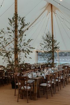 a large tent with tables and chairs set up for an event