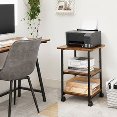 a desk with a printer on it next to a chair