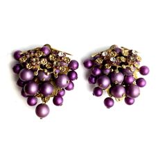 Add a touch of vintage charm to your collection with these delightful 1950s purple grape cluster clip-on earrings. Featuring a beautiful purple hue with elegant gold accents, these earrings measure 1 1/2" in full length. They are in great condition with no signs of wear or age, making them a perfect addition to any vintage jewelry collection. Whether you're dressing up for a special occasion or adding a pop of color to your everyday look, these timeless earrings are sure to make a statement. Vintage Purple Earrings For Party, Vintage Purple Earrings, Purple Clip-on Earrings For Formal Occasions, Timeless Earrings, Walnut Creek, Purple Grapes, Floral Jewellery, Cluster Earrings, Purple Hues