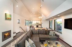 a living room filled with furniture and a fire place