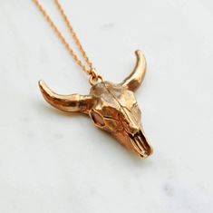 Handcrafted solid bronze cow skull hangs on a long 26” bronze rope chain with a large lobster clasp. Wear it alone as a statement piece or layer it up for a boho vibe. Cow skull measures approximately 1 ¾” x 1 ¾” and is approx 11mm thick. Each bronze piece is made by hand with bronze metal clay, kiln fired and finished to this beautiful and unique piece of solid bronze jewelry. As with any handmade item, variations are to be expected and enjoyed! **If this item is not currently in stock it will Skull Hanging, Bull Skull, Bronze Jewelry, Handmade Brand, Cow Skull, Skull Necklace, Bronze Metal, Nature Inspired Jewelry, Western Jewelry